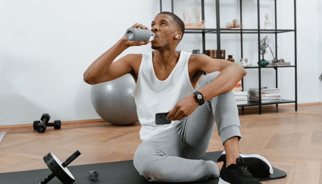 A man drinking water after a workout